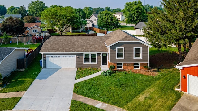 346 Princeton Ave, Bourbonnais, IL 60914 - tri-level home with a residential view, driveway, an attached garage, and a shingled roof