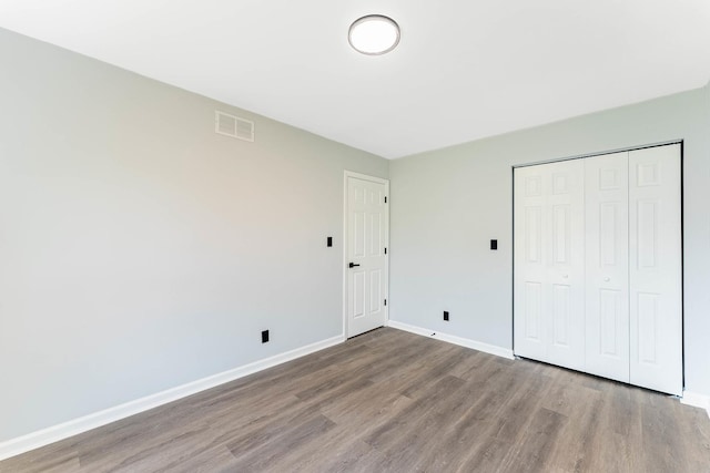346 Princeton Ave, Bourbonnais, IL 60914 - unfurnished bedroom with wood finished floors and a closet
