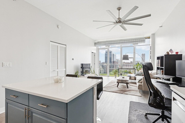 901 W Madison St Unit 1002, Chicago, IL 60607 - home office with light wood finished floors, a ceiling fan, and lofted ceiling