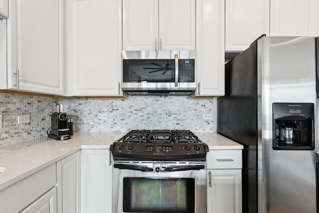901 W Madison St Unit 1002, Chicago, IL 60607 - kitchen with appliances with stainless steel finishes, white cabinetry, backsplash, and light countertops