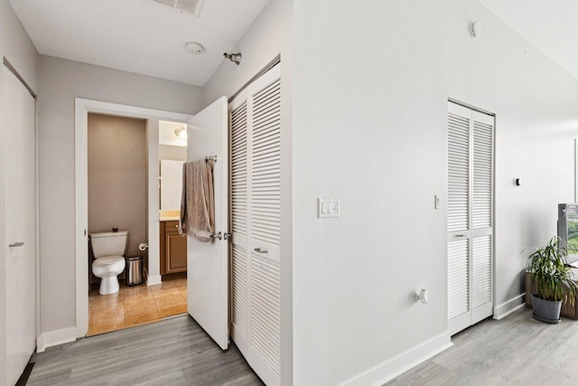 901 W Madison St Unit 1002, Chicago, IL 60607 - corridor featuring light wood-type flooring and baseboards