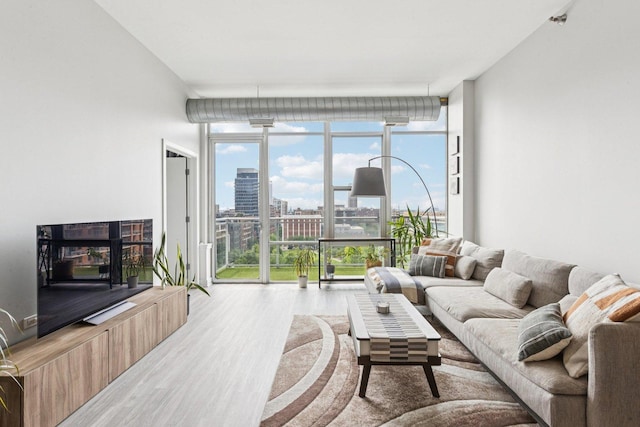 901 W Madison St Unit 1002, Chicago, IL 60607 - living area featuring expansive windows and wood finished floors