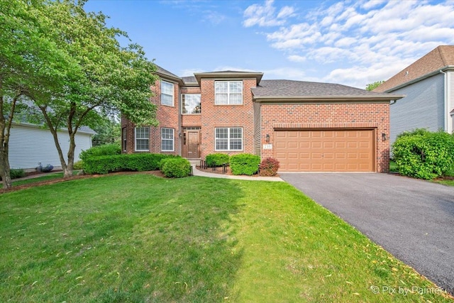 735 Chasewood Dr, South Elgin, IL 60177 - view of front of home with brick siding, asphalt driveway, a front yard, and an attached garage