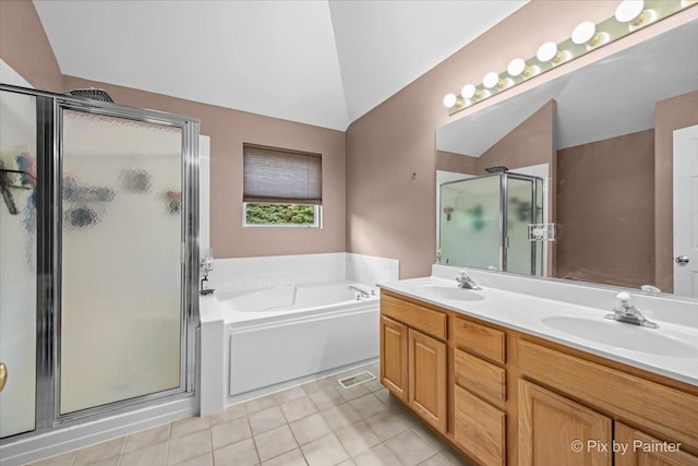 735 Chasewood Dr, South Elgin, IL 60177 - bathroom with vaulted ceiling, a shower stall, a bath, double vanity, and tile patterned floors