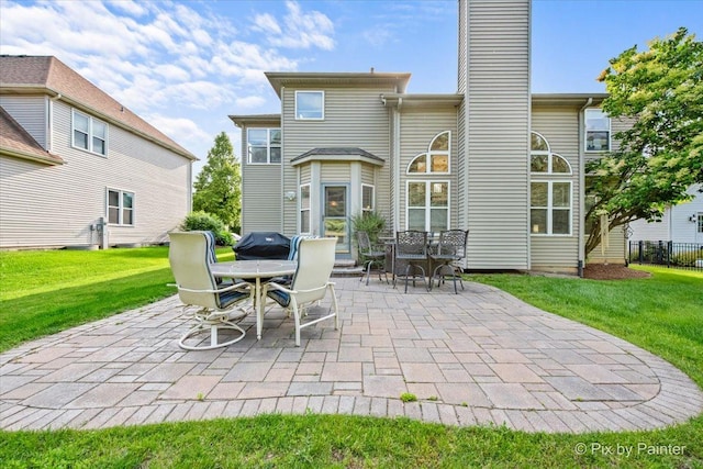 735 Chasewood Dr, South Elgin, IL 60177 - rear view of property featuring a patio area, a chimney, outdoor dining area, and a yard