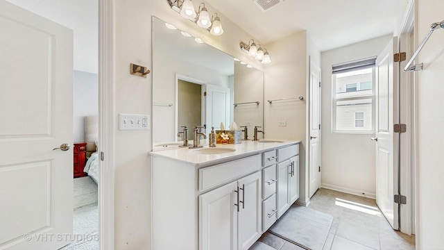 3546 Kemper Dr, Woodridge, IL 60517 - full bathroom featuring double vanity, ensuite bathroom, and tile patterned flooring