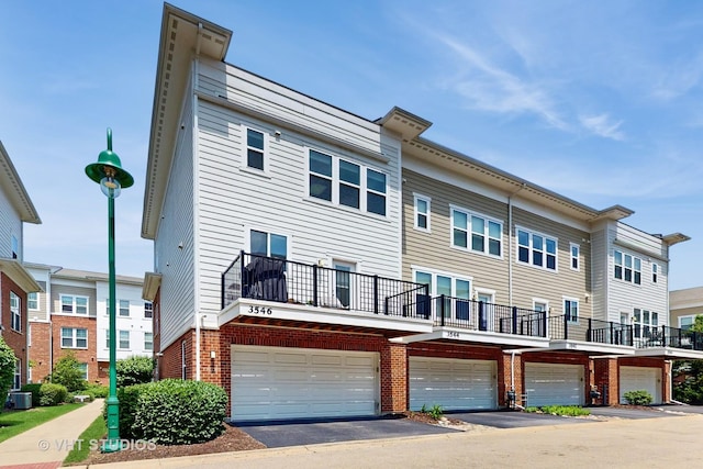 3546 Kemper Dr, Woodridge, IL 60517 - back of property with brick siding and a garage