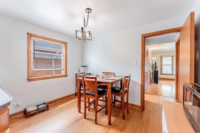 7125 S Richmond St, Chicago, IL 60629 - dining area featuring a chandelier and light wood-style floors