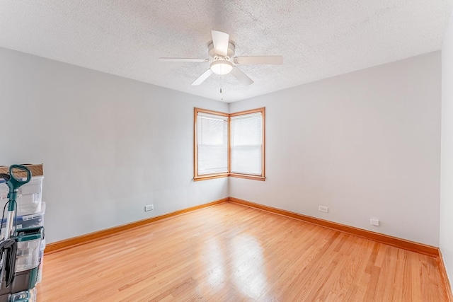 7125 S Richmond St, Chicago, IL 60629 - spare room featuring wood finished floors, ceiling fan, and a textured ceiling