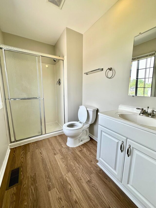 2363 Cove Dr, Hanover Park, IL 60133 - full bathroom with wood finished floors, vanity, and a stall shower