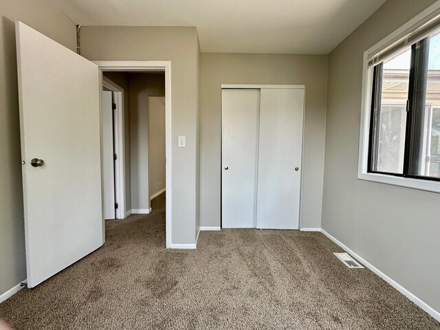 2363 Cove Dr, Hanover Park, IL 60133 - unfurnished bedroom with carpet and a closet
