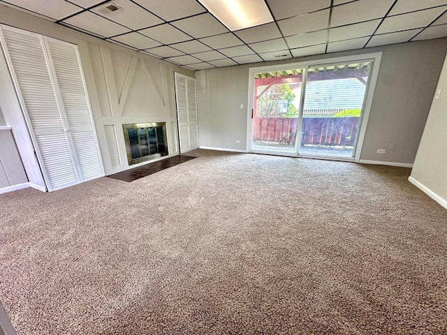 2363 Cove Dr, Hanover Park, IL 60133 - unfurnished living room featuring a drop ceiling, carpet floors, and a large fireplace