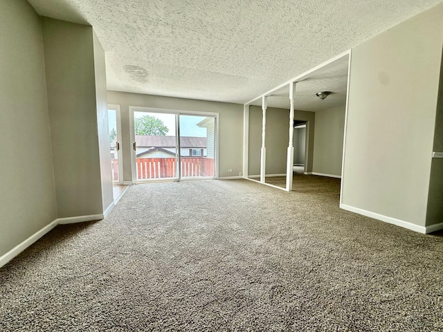 2363 Cove Dr, Hanover Park, IL 60133 - empty room featuring carpet flooring and a textured ceiling