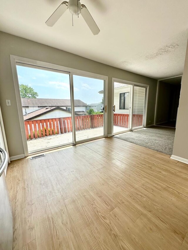2363 Cove Dr, Hanover Park, IL 60133 - unfurnished room with a ceiling fan and wood finished floors