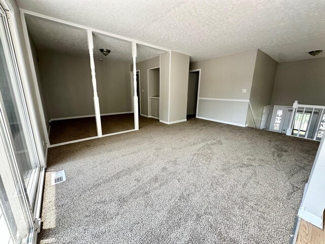 2363 Cove Dr, Hanover Park, IL 60133 - spare room with carpet and a textured ceiling