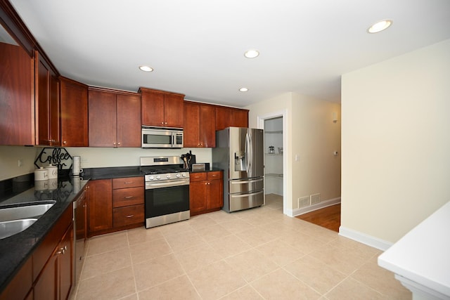 1058 Oakview Dr Unit 1058, Wheaton, IL 60187 - kitchen with stainless steel appliances, recessed lighting, and light tile patterned floors