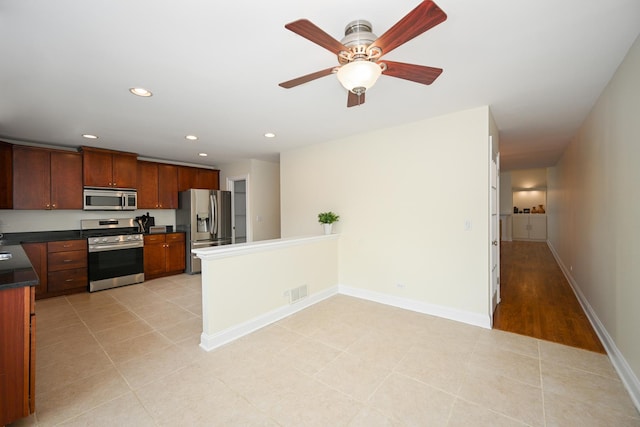 1058 Oakview Dr Unit 1058, Wheaton, IL 60187 - kitchen featuring appliances with stainless steel finishes, dark countertops, recessed lighting, ceiling fan, and a peninsula