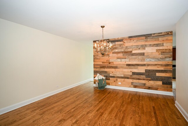 1058 Oakview Dr Unit 1058, Wheaton, IL 60187 - unfurnished room featuring wooden walls, wood finished floors, and a chandelier