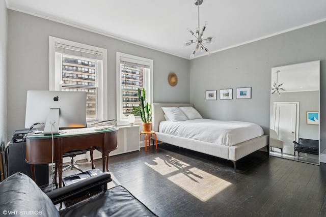 bedroom featuring crown molding, dark wood-style flooring, and an office area