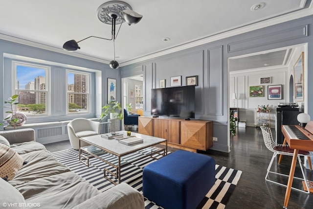 living room featuring ornamental molding, a decorative wall, wood finished floors, a desk, and recessed lighting