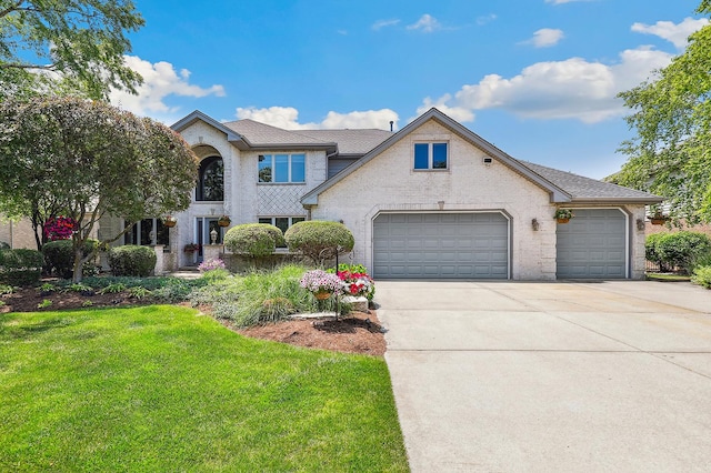 22454 Hinspeter Dr, Frankfort, IL 60423 - view of front of home featuring concrete driveway, an attached garage, a front lawn, brick siding, and a shingled roof