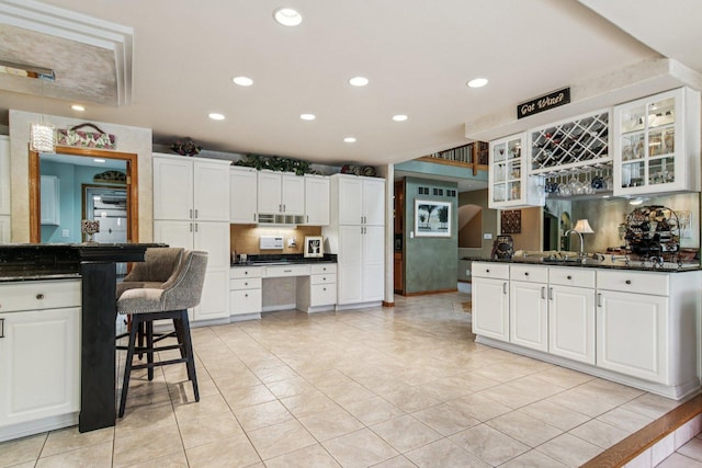22454 Hinspeter Dr, Frankfort, IL 60423 - kitchen featuring light tile patterned floors, recessed lighting, glass insert cabinets, and white cabinets