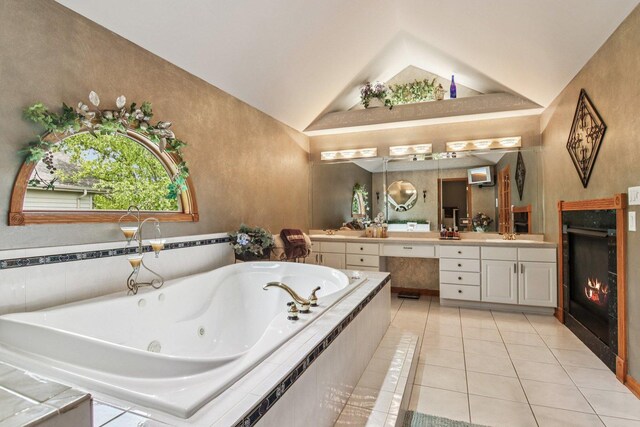 22454 Hinspeter Dr, Frankfort, IL 60423 - bathroom with double vanity, tile patterned flooring, lofted ceiling, a tub with jets, and a warm lit fireplace