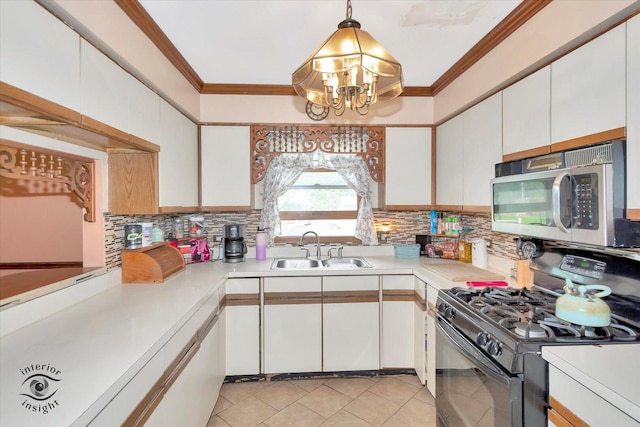 5S558 Tuthill Rd, Naperville, IL 60563 - kitchen with stainless steel microwave, gas stove, light countertops, ornamental molding, and white cabinetry