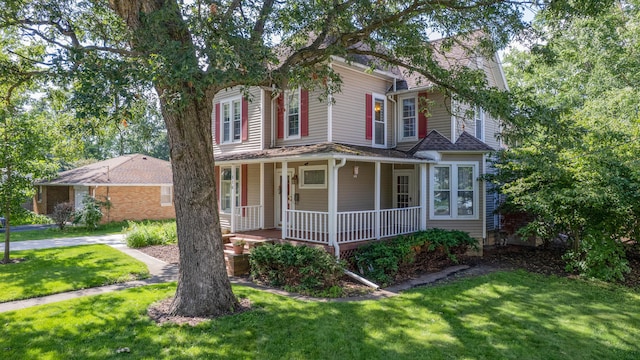 516 E Locust St, Watseka, IL 60970 - view of front facade featuring a porch and a front yard