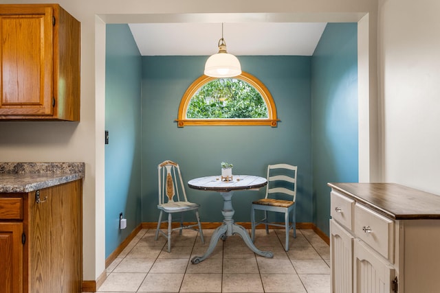 516 E Locust St, Watseka, IL 60970 - dining space with baseboards and light tile patterned floors