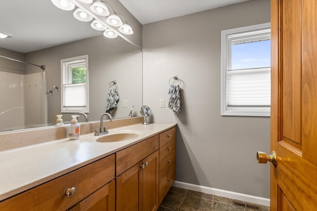 516 E Locust St, Watseka, IL 60970 - bathroom with vanity, a shower, and tile patterned floors