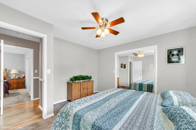226 S Rathje Rd, Peotone, IL 60468 - bedroom featuring carpet flooring, a ceiling fan, and wood finished floors