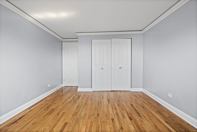 9633 Brandy Ct Unit 6, Des Plaines, IL 60016 - unfurnished bedroom featuring crown molding, light wood finished floors, and a closet