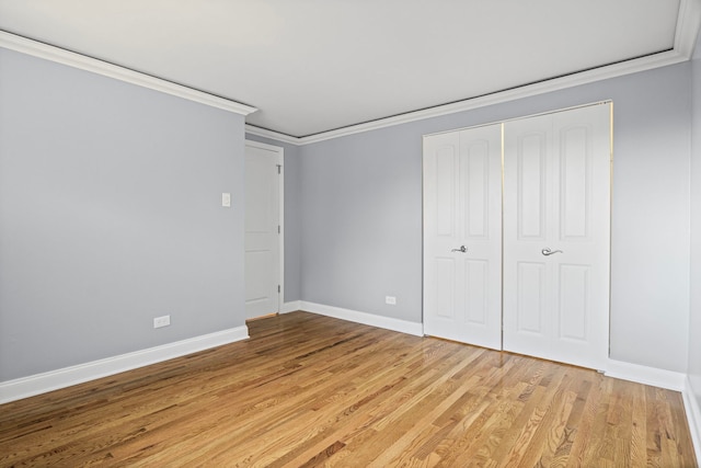 9633 Brandy Ct Unit 6, Des Plaines, IL 60016 - unfurnished bedroom featuring ornamental molding, light wood-type flooring, and a closet