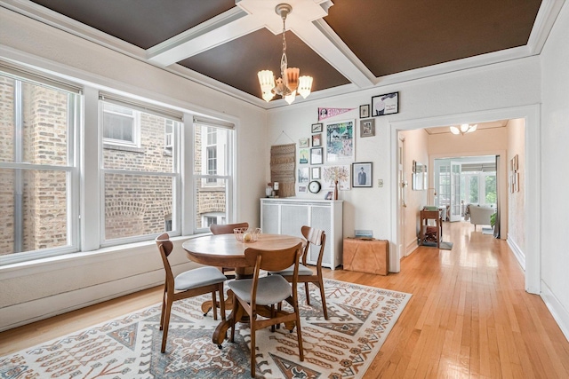 4706 N Paulina St, Chicago, IL 60640 - dining area featuring a chandelier, light wood-type flooring, beamed ceiling, and coffered ceiling