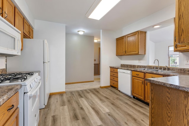 212 Jake Ln, Hampshire, IL 60140 - kitchen featuring white appliances, light wood-type flooring, and brown cabinets