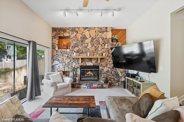 4832 Crest Ct, Waukegan, IL 60087 - carpeted living room featuring a stone fireplace and a ceiling fan
