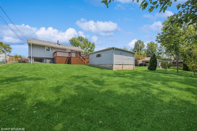 7626 Deerfield Ave, Woodridge, IL 60517 - view of green lawn with a wooden deck