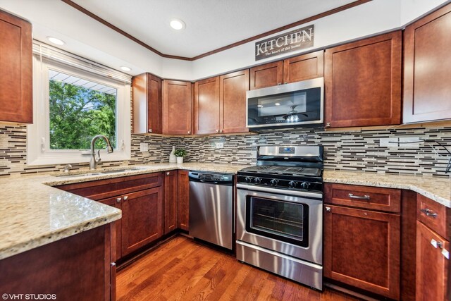 7626 Deerfield Ave, Woodridge, IL 60517 - kitchen with stainless steel appliances, dark wood-style floors, light stone countertops, decorative backsplash, and ornamental molding