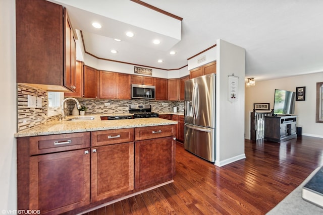 7626 Deerfield Ave, Woodridge, IL 60517 - kitchen featuring appliances with stainless steel finishes, dark wood-style floors, tasteful backsplash, light stone countertops, and recessed lighting