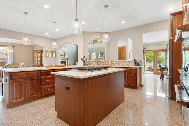 2024 Taller Rd, Morris, IL 60450 - kitchen featuring arched walkways, stainless steel gas cooktop, a center island, light countertops, and recessed lighting