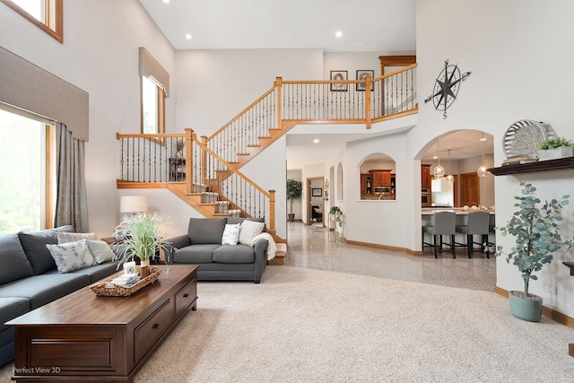 2024 Taller Rd, Morris, IL 60450 - living area with a high ceiling, stairs, arched walkways, and recessed lighting