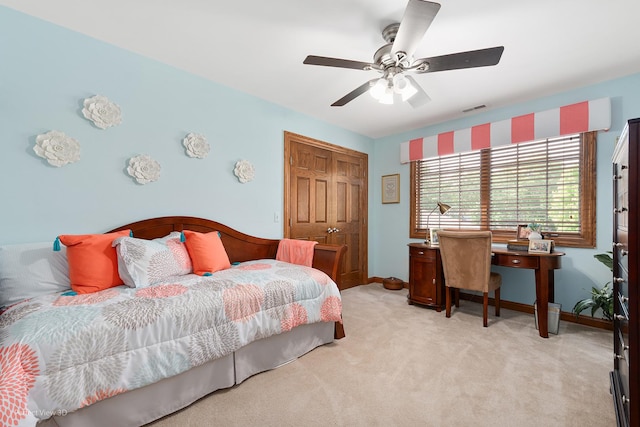 2024 Taller Rd, Morris, IL 60450 - bedroom featuring light carpet, a closet, and ceiling fan