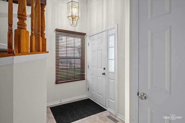 1836 Candlelight Cir Unit 1836, Montgomery, IL 60538 - entrance foyer featuring tile patterned floors and a chandelier