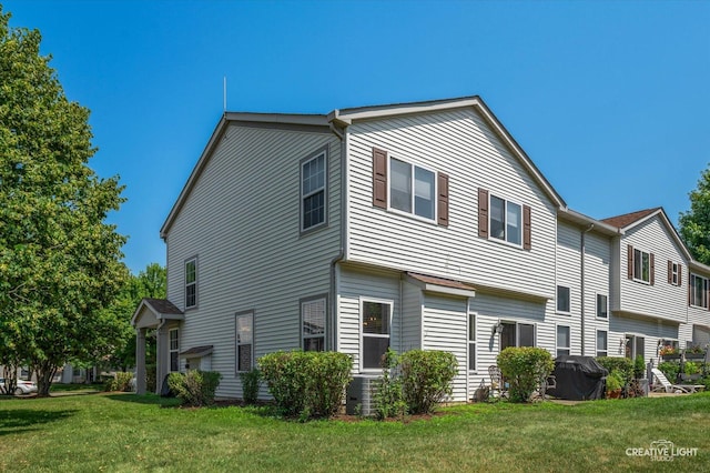 1836 Candlelight Cir Unit 1836, Montgomery, IL 60538 - view of property exterior with a yard