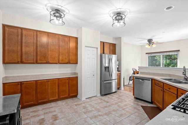 1836 Candlelight Cir Unit 1836, Montgomery, IL 60538 - kitchen with stainless steel appliances, brown cabinets, light tile patterned floors, ceiling fan, and light countertops