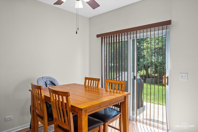 1836 Candlelight Cir Unit 1836, Montgomery, IL 60538 - dining room featuring a ceiling fan and wood finished floors