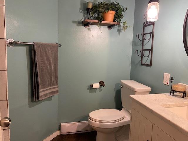 23 Acapulco Dr, Putnam, IL 61560 - bathroom with a baseboard radiator and vanity
