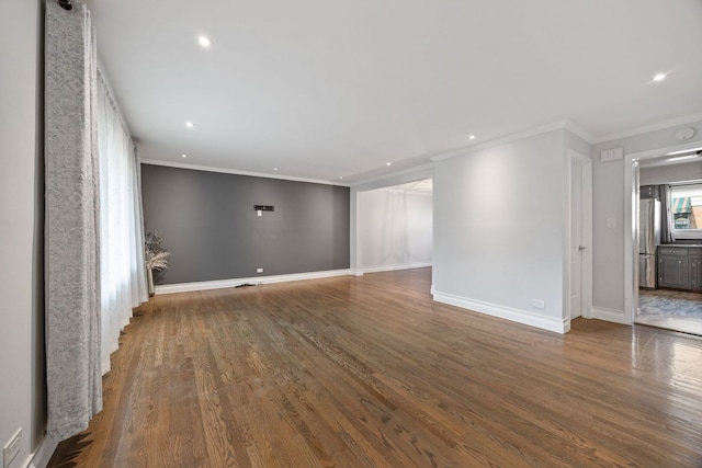 7013 W Greenleaf St, Niles, IL 60714 - empty room with wood finished floors, recessed lighting, and crown molding