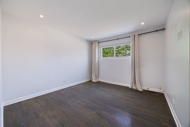 7013 W Greenleaf St, Niles, IL 60714 - spare room with dark wood-type flooring and recessed lighting